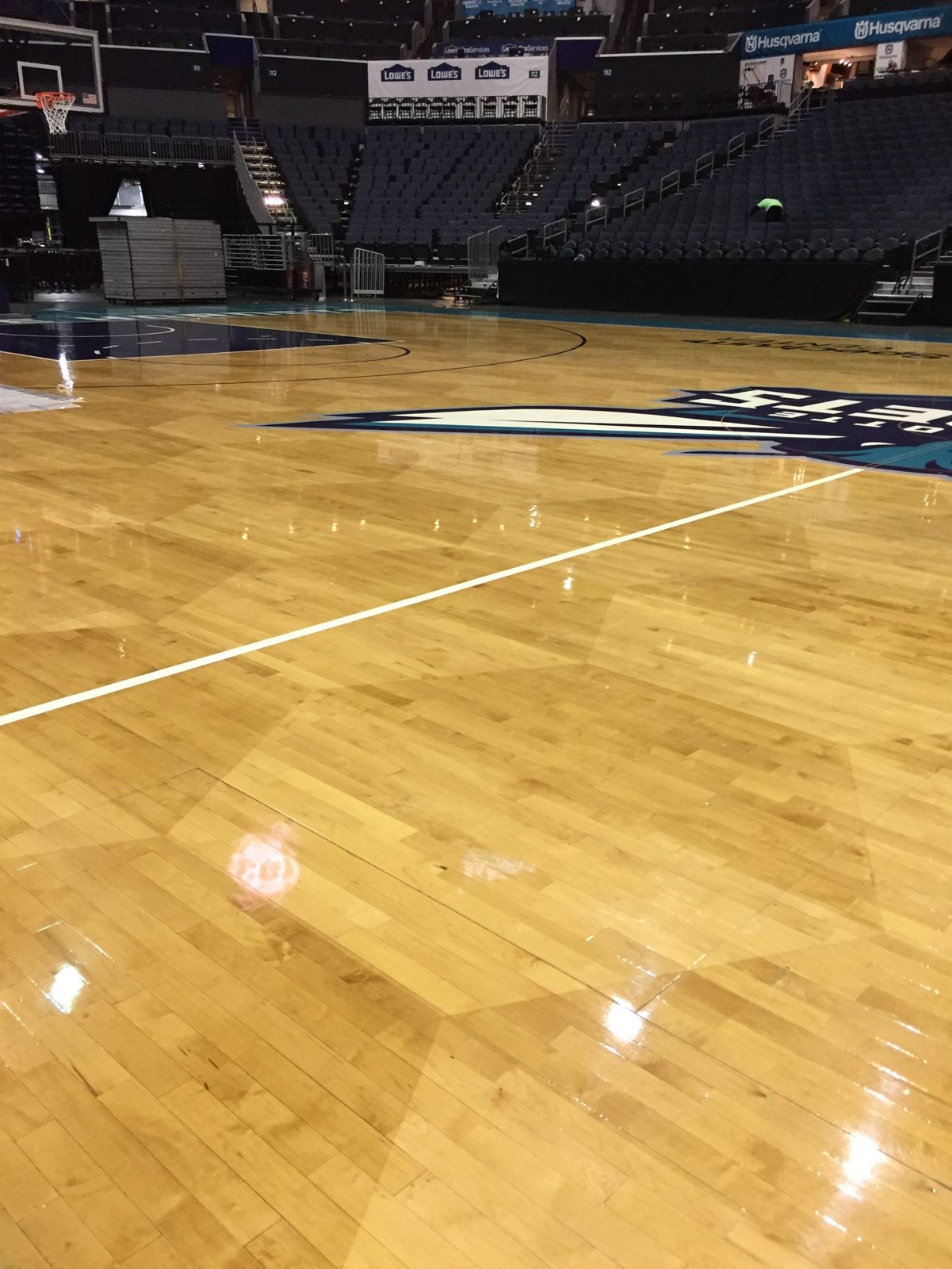 Arena basketball court with gleaming hardwood
