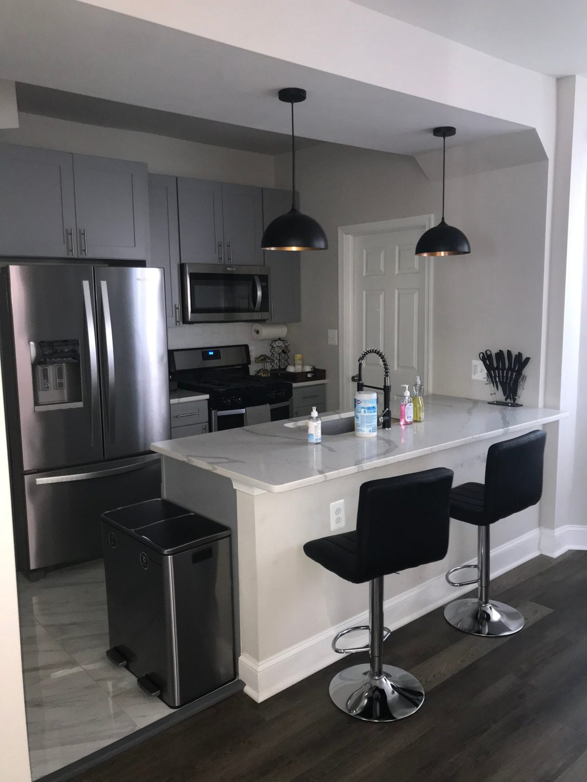 Spotless kitchen with marble counters and stainless appliances