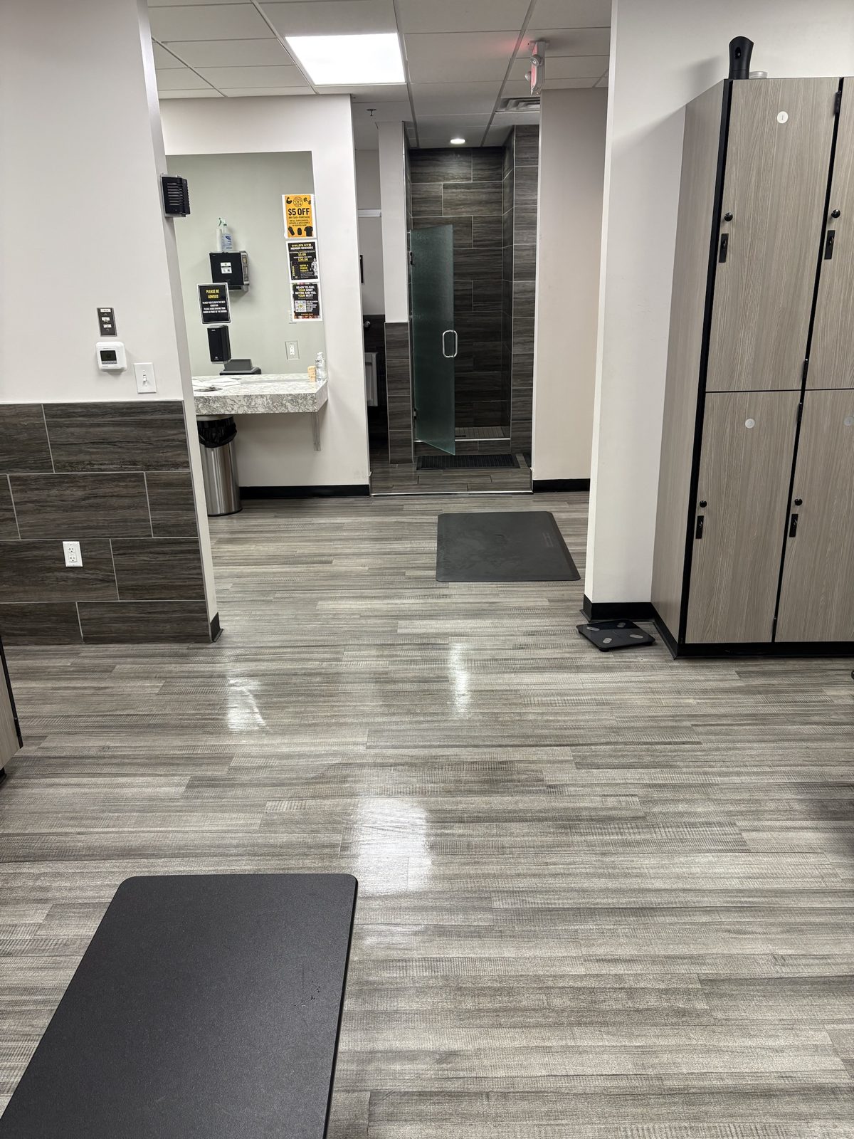 Locker room with polished floors and showers