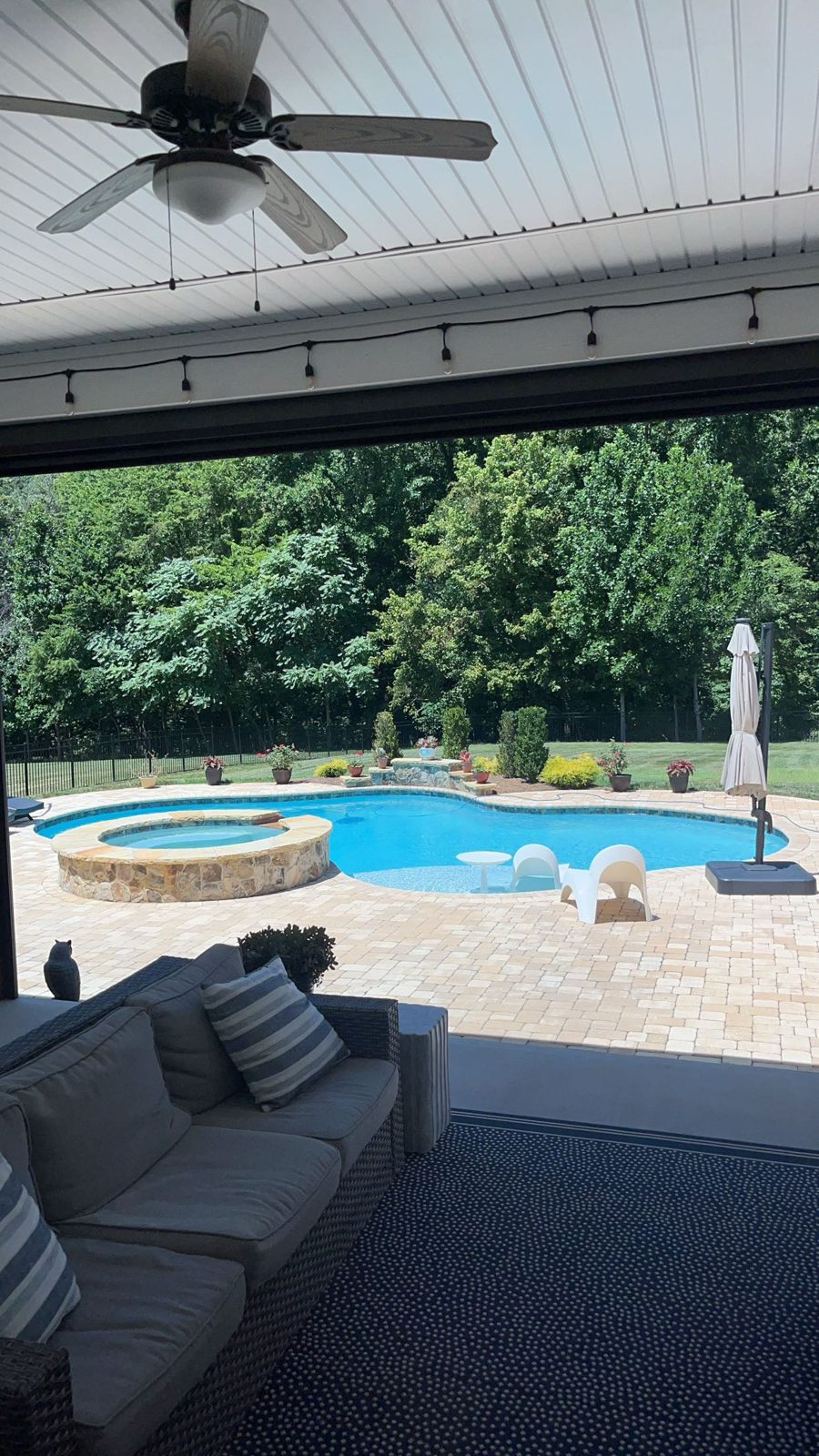 Backyard pool and stone patio