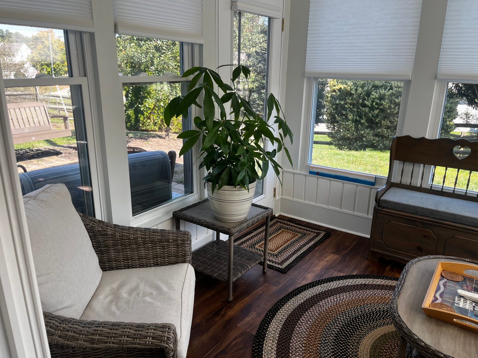 Sunroom with wicker chair and plant